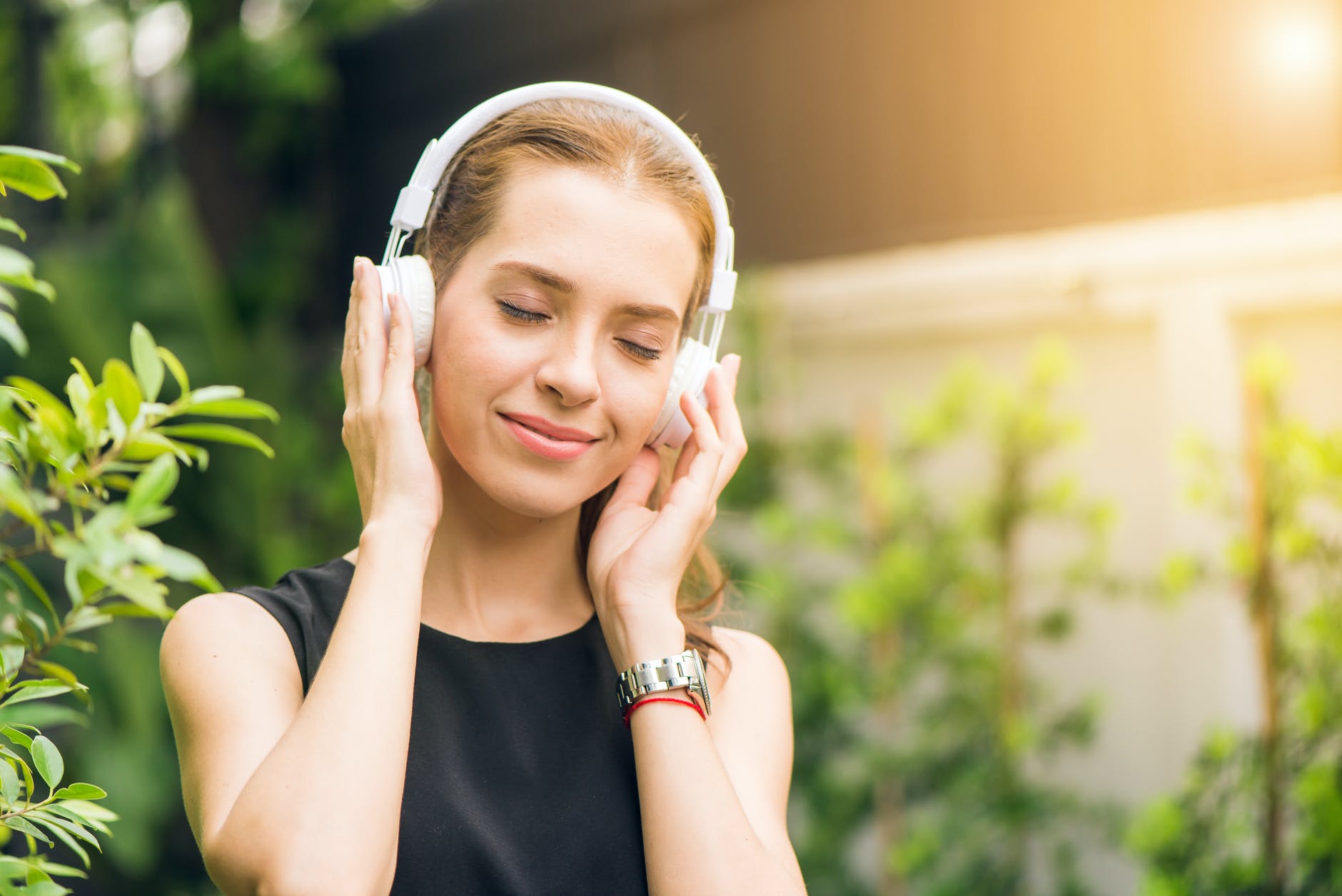 Woman listening to writer's mindset podcasts